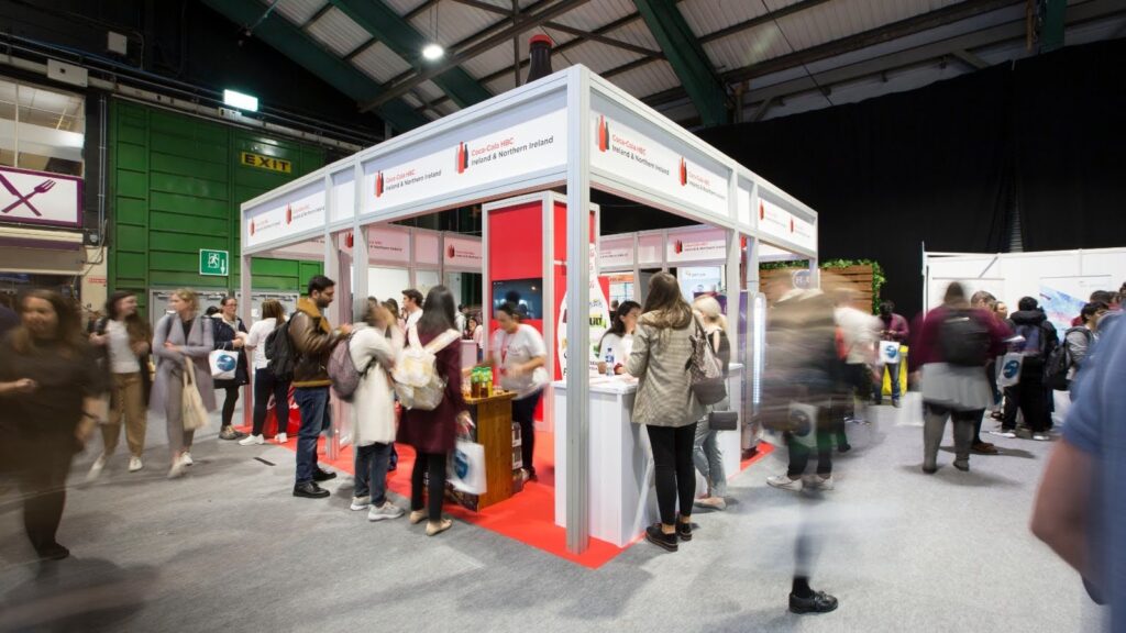 Coca Cola Exhibition Stand with crowd of people