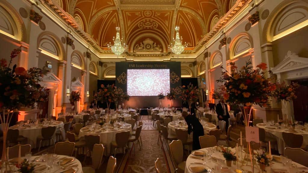 An event production in a large room, classical in style