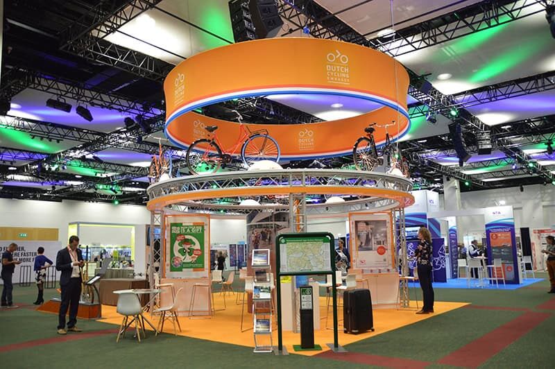 A custom exhibition stand with orange materials and bicycles