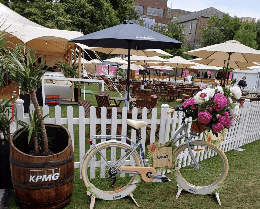 An outdoor event for KPMG with stand and staging.