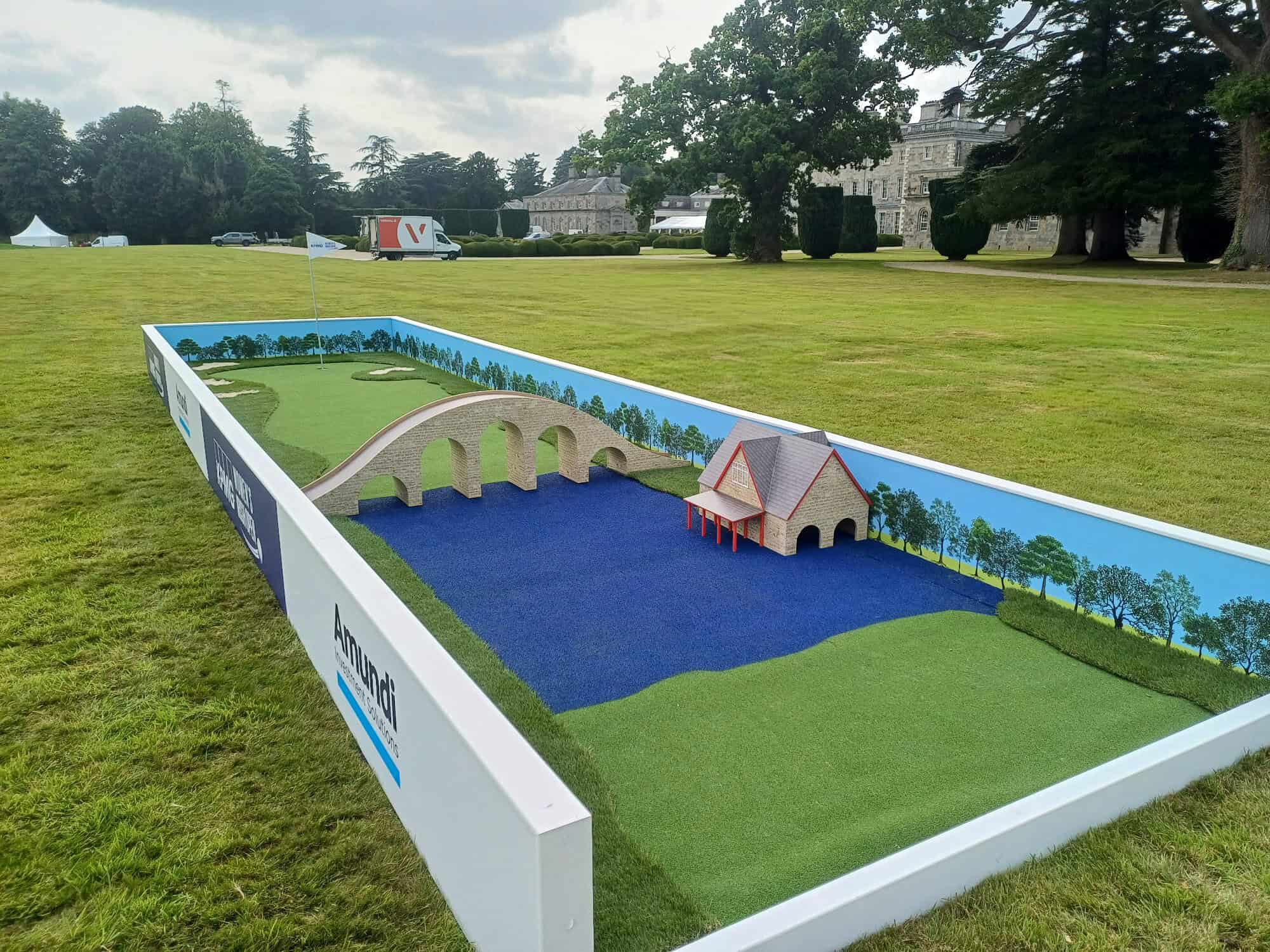 a mini golf putt in an open field, handbuilt for the irish women's open