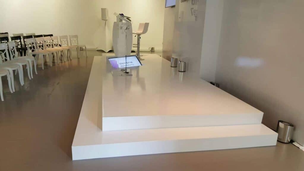 A glossy white stage at an event