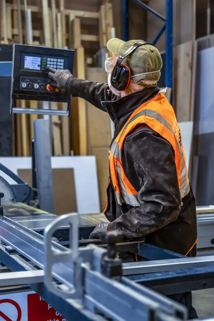a man working at a table saw